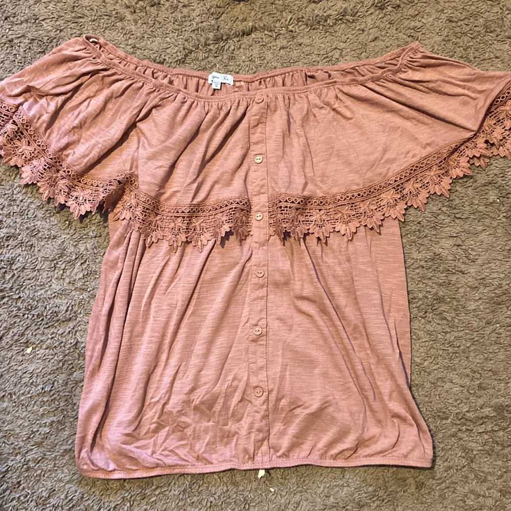 It’s a blouse that is made by taper tee. It’s a 1X and its like a nude pink